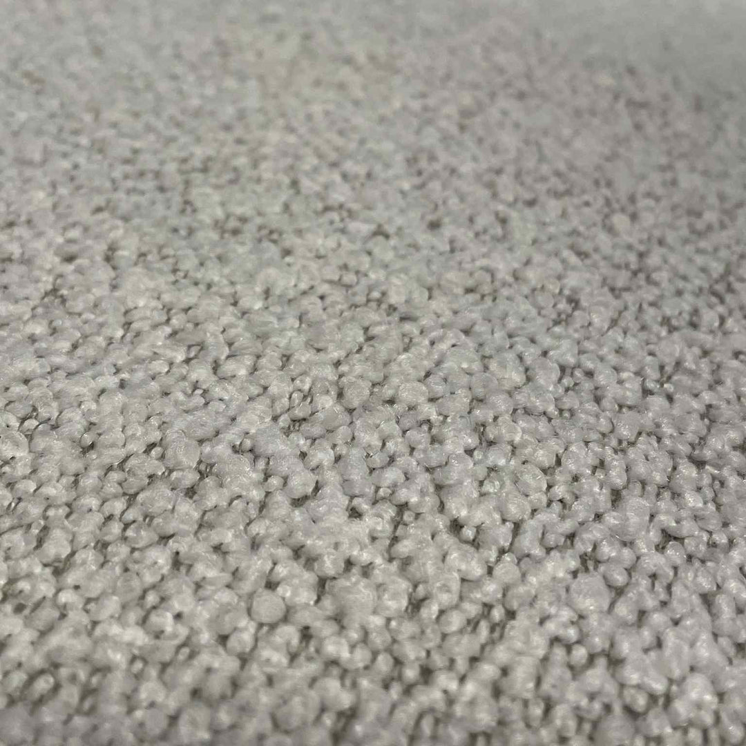 Closeup af betræk på Streamline Sofa fra Eilersen. Teddy bouclé stof i hvid